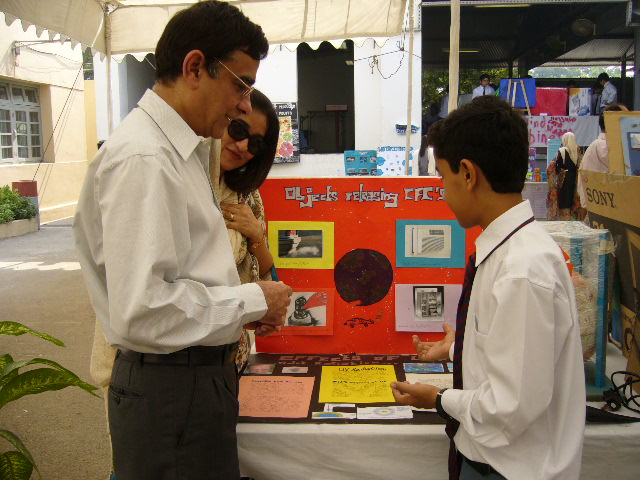 Dr. Laghari at the Science Exhibition at the Karachi Grammar School viewing 